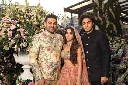 Arbaaz Khan's son from his first marriage with Malaika Arora, Arhaan Khan, poses with his father and his new wife Sshura Khan at their wedding in Mumbai. Arbaaz Khan's son from his first marriage with Malaika Arora, Arhaan Khan, poses with his father and his new wife Sshura Khan at their wedding in Mumbai.