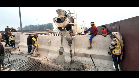 Barricading by police and local administration being done as security being enhanced in Ambala in view of farmers' call for march to Delhi, on Saturday. (ANI)