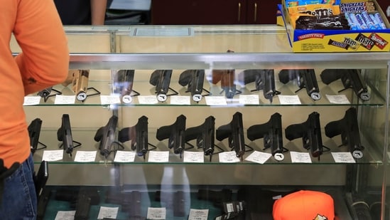 FILE - Handguns are displayed at a gun shop on June 23, 2022, in Honolulu. A ruling by Hawaii's high court saying that a man can be prosecuted for carrying a gun in public without a permit uses pop culture references in an apparent rebuke of a U.S. Supreme Court decision that expanded gun rights nationwide. (AP Photo/Marco Garcia, File) (AP)