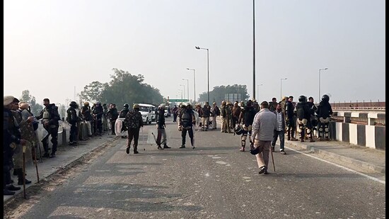 Paramilitary personnel stay vigil after security tightened ahead of the farmers' march to Delhi in Ambala on Saturday. (ANI)