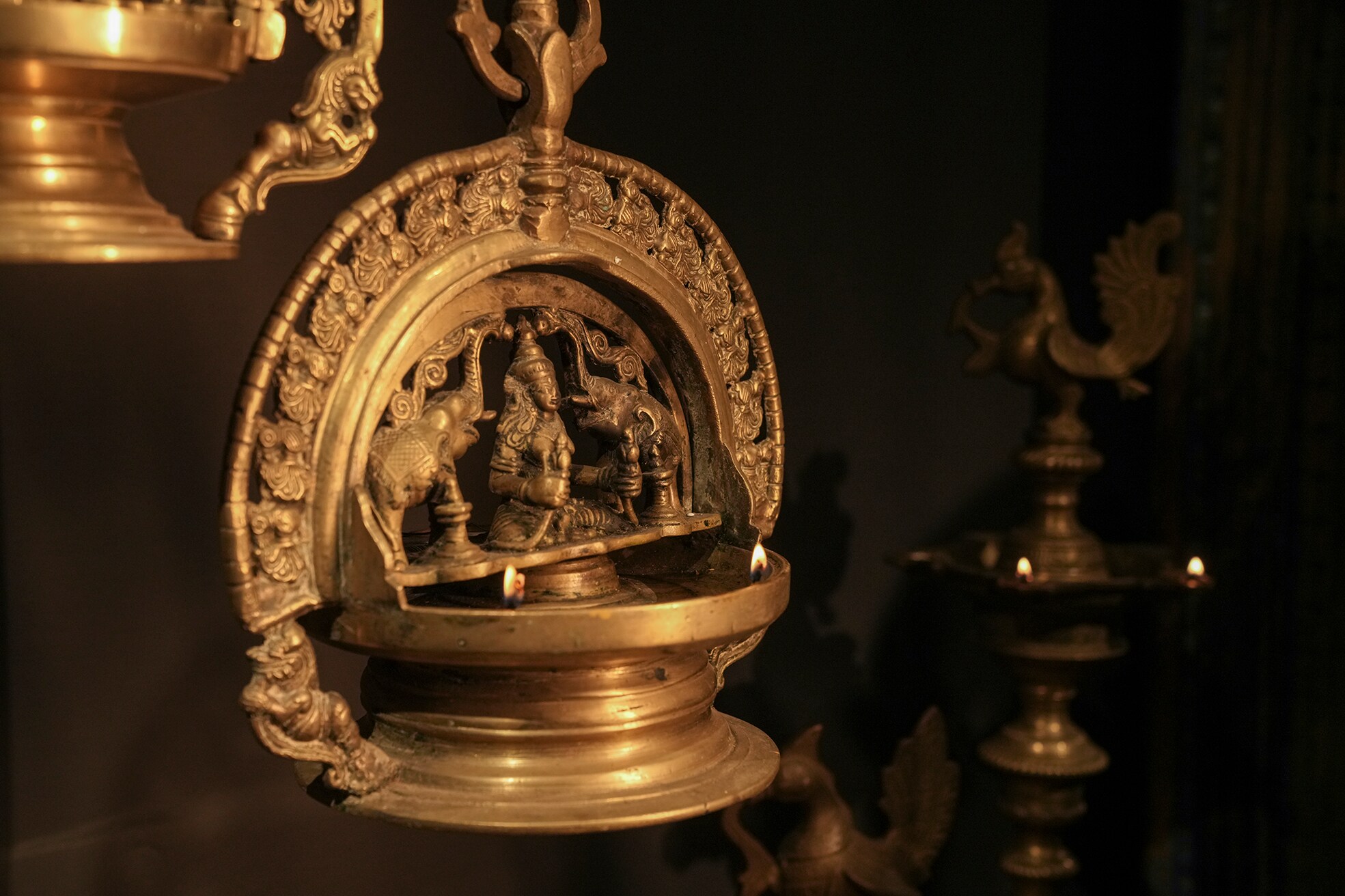 An intricate lamp from Kerala featuring the goddess Lakshmi. An intricate lamp from Kerala featuring the goddess Lakshmi.
