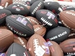 Feb 10, 2024; Las Vegas, NV, USA; Wilson footballs with the Super Bowl 58 logo at the NFL Experience at the Mandalay Bay South Convention Center. Mandatory Credit: Kirby Lee-USA TODAY Sports