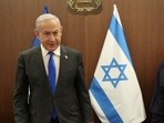 Israeli Prime Minister Benjamin Netanyahu takes a seat.