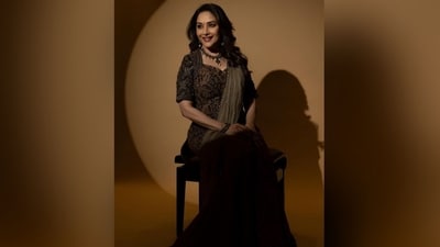 For accessorising, she opted for a chunky silver necklace, a pair of statement earrings, black bangles on her wrist and a small black bindi on her forehead. Her make-up included kohl eyes, mascaraed lashes, blurred eyes and maroon lipstick. She finished off her look with her curly hair left open in the middle partition. (Instagram/@madhuridixitnene) For accessorising, she opted for a chunky silver necklace, a pair of statement earrings, black bangles on her wrist and a small black bindi on her forehead. Her make-up included kohl eyes, mascaraed lashes, blurred eyes and maroon lipstick. She finished off her look with her curly hair left open in the middle partition. (Instagram/@madhuridixitnene)