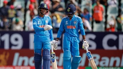 Adarsh Singh (L) was India's highest scorer on the day with a 77-ball 47. Murugan Abhishek (R) put on late fight for the Boys in Blue in the presence of Naman Tiwari, adding 46 runs for the ninth wicket, India's highest in the match, but the task proved beyond his reach. (AFP)