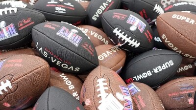 Feb 10, 2024; Las Vegas, NV, USA; Wilson footballs with the Super Bowl 58 logo at the NFL Experience at the Mandalay Bay South Convention Center. Mandatory Credit: Kirby Lee-USA TODAY Sports (USA TODAY Sports via Reuters Con)