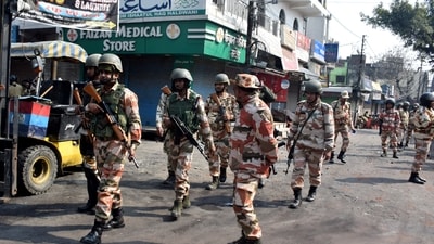 Police officers patrol a road a day after clashes during a government demolition drive, in Haldwani. (Reuters)