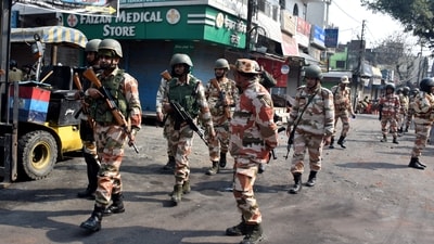 Police officers patrol a road a day after clashes during a government demolition drive in Haldwani. (Reuters)