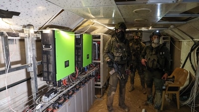 This picture shows Israeli soldiers inside a tunnel that the army claimed is a "Hamas command tunnel" under a compound of the United Nations Relief and Works Agency for Palestine Refugees (UNRWA) in Gaza City. (AFP) This picture shows Israeli soldiers inside a tunnel that the army claimed is a "Hamas command tunnel" under a compound of the United Nations Relief and Works Agency for Palestine Refugees (UNRWA) in Gaza City. (AFP)