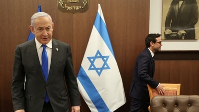 Israeli Prime Minister Benjamin Netanyahu takes a seat. (Reuters)