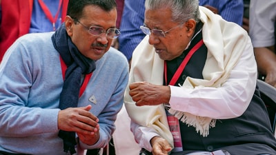 Delhi Chief Minister Arvind Kejriwal interacts with Kerala Chief Minister Pinarayi Vijayan during LDF's protest against the BJP-led Centre over alleged neglect and partiality in allocation of funds to their states, at Jantar Mantar, in New Delhi, (PTI)