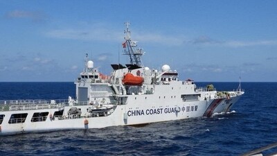 A China Coast Guard vessel manoeuvres near Philippine Coast Guard vessel BRP Teresa Magbanua near Scarborough Shoal in the South China Sea. (Reuters)