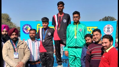 Sumit Kumar (centre) and Daljit Singh (left) during the award ceremony at games for ‘Children with Special Needs’ In Kapurthala. (HT Photo) Sumit Kumar (centre) and Daljit Singh (left) during the award ceremony at games for ‘Children with Special Needs’ In Kapurthala. (HT Photo)
