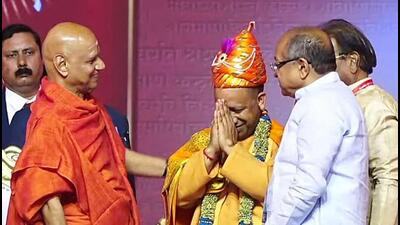 Uttar Pradesh chief minister Yogi Adityanath being felicitated during the ‘Gita Bhakti Amrit Mahotsav’ organised on the occasion of the 75th birthday of spiritual Guru Govind Dev Giri Maharaj, in Pune on Sunday (ANI PHOTO)