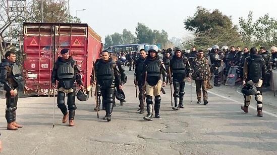 Paramilitary personnel stay vigil after security tightened ahead of the Farmers' march to Delhi, which is scheduled to be held on 13th February, in Ambala on Saturday. (ANI)