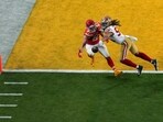 Kansas City Chiefs tight end Travis Kelce, left, is unable to catch a pass while defended by San Francisco 49ers linebacker Fred Warner during the second half of the NFL Super Bowl 58 football game Sunday, Feb. 11, 2024, in Las Vegas. (AP Photo/David J. Phillip)