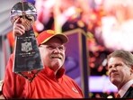 Kansas City Chiefs head coach Andy Reid holds the Vince Lombardi Trophy as Kansas City Chiefs chairman and CEO Clark Hunt looks on after the NFL Super Bowl 58 football game against the San Francisco 49ers on Sunday, Feb. 11, 2024, in Las Vegas. The Chiefs won 25-22.(AP Photo/Ashley Landis)