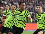 Arsenal's Brazilian defender #06 Gabriel Magalhaes (C) celebrates after scoring their third goal during the English Premier League football match between West Ham United and Arsenal