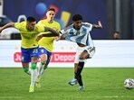 Brazil's Gabriel Pec (L) and Argentina's Cristian Medina (R) fight for the ball Brazil's Gabriel Pec (L) and Argentina's Cristian Medina (R) fight for the ball