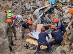 Rescuers recover bodies at the landslide-hit village of Maco in Davao de Oro province, southern Philippines. (AP) Rescuers recover bodies at the landslide-hit village of Maco in Davao de Oro province, southern Philippines. (AP)
