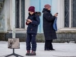 Russia-Ukraine War: Local residents use a Starlink terminal amid Russia's attack on Ukraine, in Chasiv Yar, Donetsk region, Ukraine.