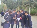 Students at La Martiniere discussing about their question paper with their friends after day 1 of the exam here in Lucknow