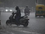 Commuters wading through water-filled roads as rainfall batters Delhi. Commuters wading through water-filled roads as rainfall batters Delhi.