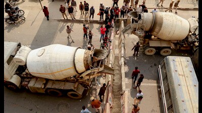Barricades being put up at Ghazipur border in view of farmers' 'Delhi Chalo March', in New Delhi on Monday. (PTI) Barricades being put up at Ghazipur border in view of farmers' 'Delhi Chalo March', in New Delhi on Monday. (PTI)