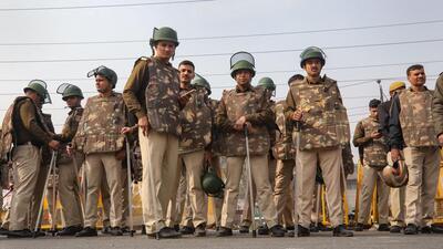 Police personnel deployed near Singhu border in view of farmers’ ’Delhi Chalo March’. (PTI) Police personnel deployed near Singhu border in view of farmers’ ’Delhi Chalo March’. (PTI)