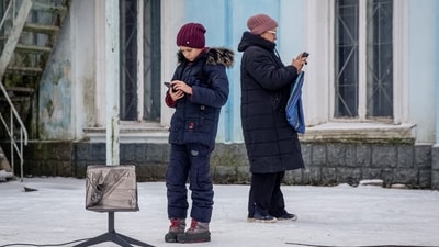 Russia-Ukraine War: Local residents use a Starlink terminal amid Russia's attack on Ukraine, in Chasiv Yar, Donetsk region, Ukraine. (Reuters)