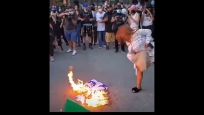A New York City professor Shellyne Rodriguez was caught on video burning an American flag (YouTube screenshot) A New York City professor Shellyne Rodriguez was caught on video burning an American flag (YouTube screenshot)