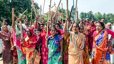Women protest against TMC leader Sheikh Shajahan in West Bengal’s North 24 Parganas district on Friday. (ANI) Women protest against TMC leader Sheikh Shajahan in West Bengal’s North 24 Parganas district on Friday. (ANI)