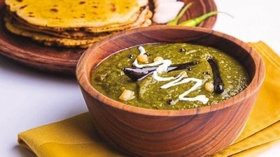 Sarson Ka Saag with Makki Ki Roti: A classic Punjabi dish made with mustard greens and served with maize flour bread, a hearty and nutritious meal to enjoy during the festival. (Shutterstock) Sarson Ka Saag with Makki Ki Roti: A classic Punjabi dish made with mustard greens and served with maize flour bread, a hearty and nutritious meal to enjoy during the festival. (Shutterstock)