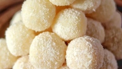 Coconut Ladoo: Sweet balls made with grated coconut, condensed milk, and cardamom, a delicious treat to mark the auspicious occasion. (Pinterest) Coconut Ladoo: Sweet balls made with grated coconut, condensed milk, and cardamom, a delicious treat to mark the auspicious occasion. (Pinterest)