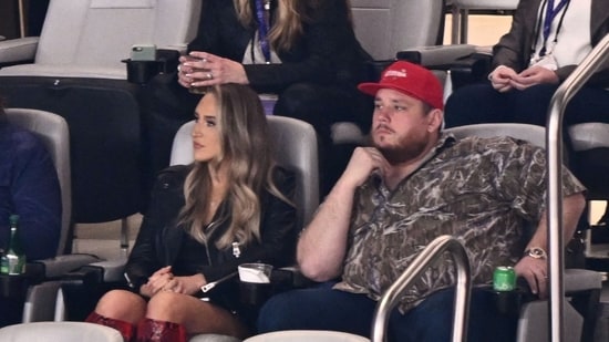 US singer-songwriter Luke Combs (R) and wife Nicole Hocking attend Super Bowl LVIII between the Kansas City Chiefs and the San Francisco 49ers at Allegiant Stadium in Las Vegas, Nevada, February 11, 2024. (Photo by Patrick T. Fallon / AFP)(AFP)