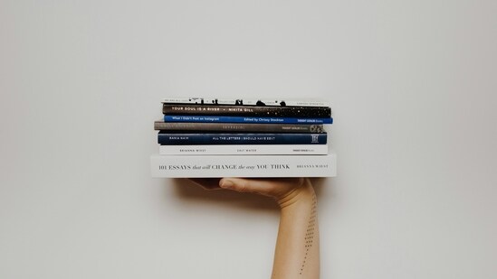 Books and Stationery: Nurture your intellect and creativity by purchasing books, notebooks, or art supplies. These items not only signify a thirst for knowledge but also encourage you to explore new horizons.(Unsplash)