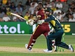 West Indies' Andre Russell plays a shot next to Australia's wicket-keeper Matthew Wade West Indies' Andre Russell plays a shot next to Australia's wicket-keeper Matthew Wade