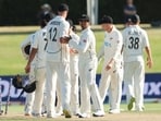New Zealand's Kyle Jamieson (L) and Rachin Ravindra (C) celebrate New Zealand's Kyle Jamieson (L) and Rachin Ravindra (C) celebrate