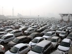 Commuters stuck in a massive traffic jam on the Delhi-Gurugram Expressway near Sirhaul toll plaza amid restrictions in vehicular traffic due to the farmers' 'Delhi Chalo' march, in Gurugram on Tuesday.