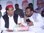 Samajwadi Party president Akhilesh Yadav and party leader Swami Prasad Maurya. (Deepak Gupta/HT Photo)