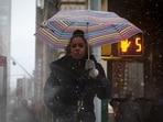 FILE PHOTO: A person makes her way through snow and wind during a Nor'easter storm in lower Manhattan in New York City, U.S., March 14, 2023.  REUTERS/Brendan McDermid/File Photo