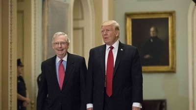 In this photo taken in October 2017, then President Donald Trump (R) and Senate Majority Leader Mitch McConnell (R-KY) walk to a lunch with Senate Republicans on Capitol Hill in Washington, DC. (AFP) In this photo taken in October 2017, then President Donald Trump (R) and Senate Majority Leader Mitch McConnell (R-KY) walk to a lunch with Senate Republicans on Capitol Hill in Washington, DC. (AFP)