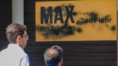 A signboard of a business establishment after being vandalised in Bengaluru. (PTI file photo)