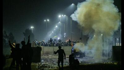 Farmers disperse after police fire tear gas to disperse farmers marching towards Delhi (AFP) Farmers disperse after police fire tear gas to disperse farmers marching towards Delhi (AFP)