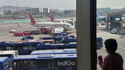 A boy looks at Air India airline passenger aircrafts parked at the Chhatrapati Shivaji Maharaj International Airport in Mumbai, India. (Reuters)
