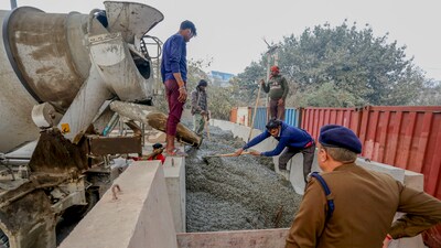 Farmers protest: Police set up concrete barricading at Bahadurgarh Chowk in view of farmers' 'Delhi Chalo' march, near New Delhi, Tuesday. (PTI) Farmers protest: Police set up concrete barricading at Bahadurgarh Chowk in view of farmers' 'Delhi Chalo' march, near New Delhi, Tuesday. (PTI)