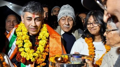 Retired Indian Navy captain Saurabh Vashishtha, who returned to India on Monday after being released from a Qatar jail, being welcomed by his family members upon his arrival at his home, in Dehradun, Tuesday, Feb. 13, 2024. (PTI)