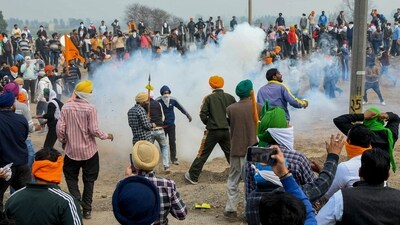 Police use tear gas shells to disperse farmers during their 'Delhi Chalo' march at Punjab-Haryana Shambhu border, near Patiala. (PTI)