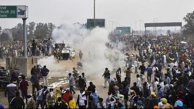 Police use tear gas to disperse farmers gathered at the Punjab-Haryana Shambhu border during their 'Delhi Chalo' march, in Patiala district, on Tuesday. (PTI) Police use tear gas to disperse farmers gathered at the Punjab-Haryana Shambhu border during their 'Delhi Chalo' march, in Patiala district, on Tuesday. (PTI)