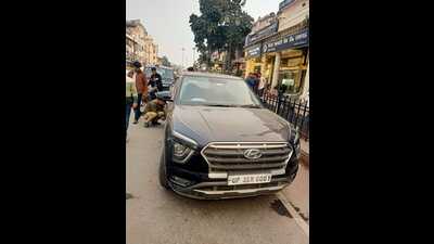 Traffic police clamping a wrongly-parked car at Hazratganj in the city on Tuesday. (Sourced)